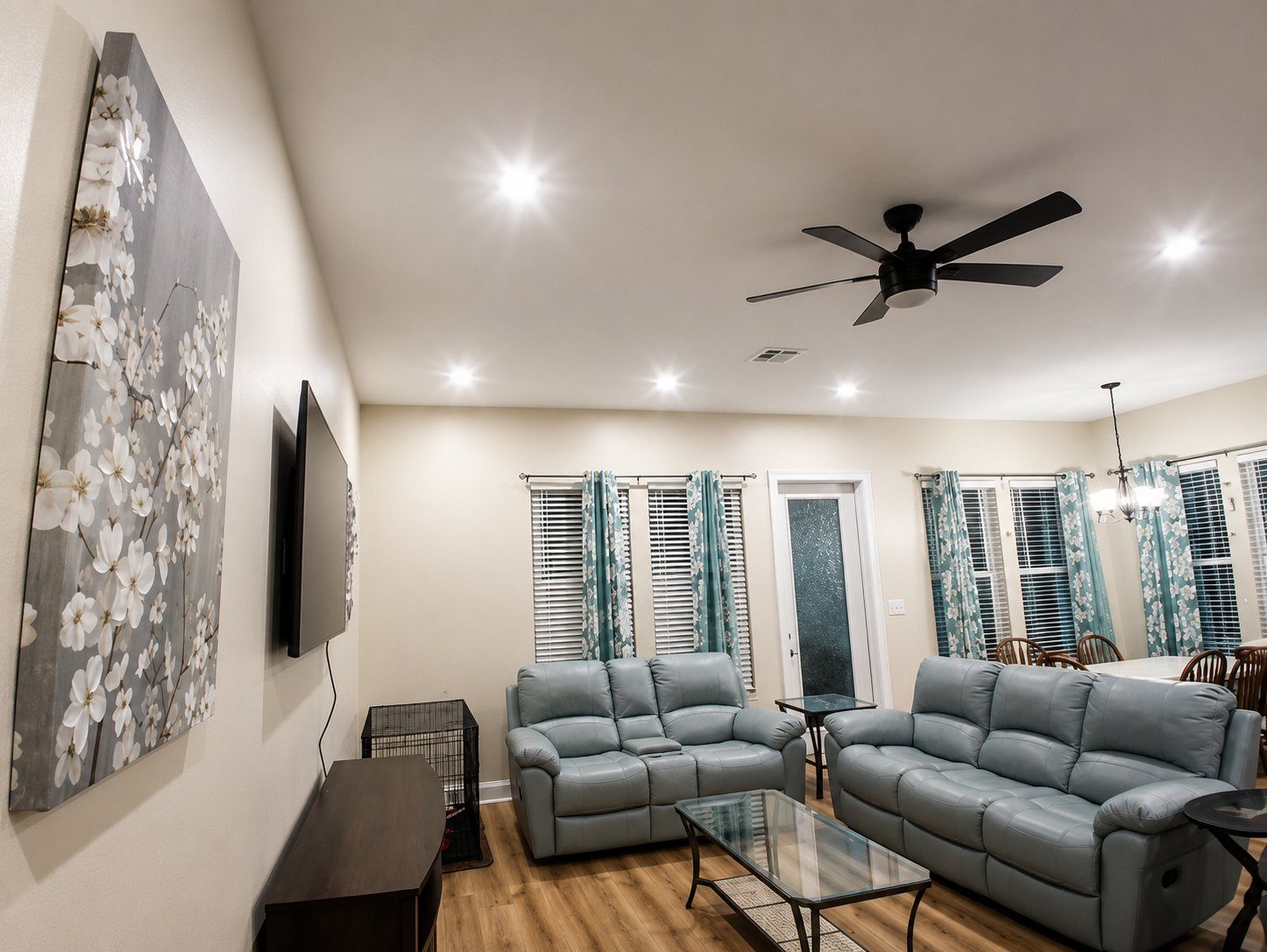 Ceiling fan and recessed lighting installed in an open living room